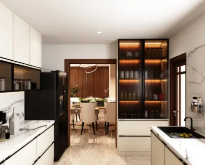 Bright parallel kitchen with marble countertops, white cabinets, black refrigerator, and glass-fronted storage units with warm lighting.