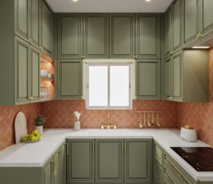 Classic green U-shaped kitchen featuring paneled cabinets, white countertops, and terracotta tile backsplash with gold-toned fixtures