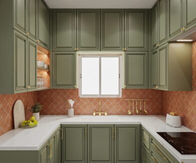 Classic green U-shaped kitchen featuring paneled cabinets, white countertops, and terracotta tile backsplash with gold-toned fixtures